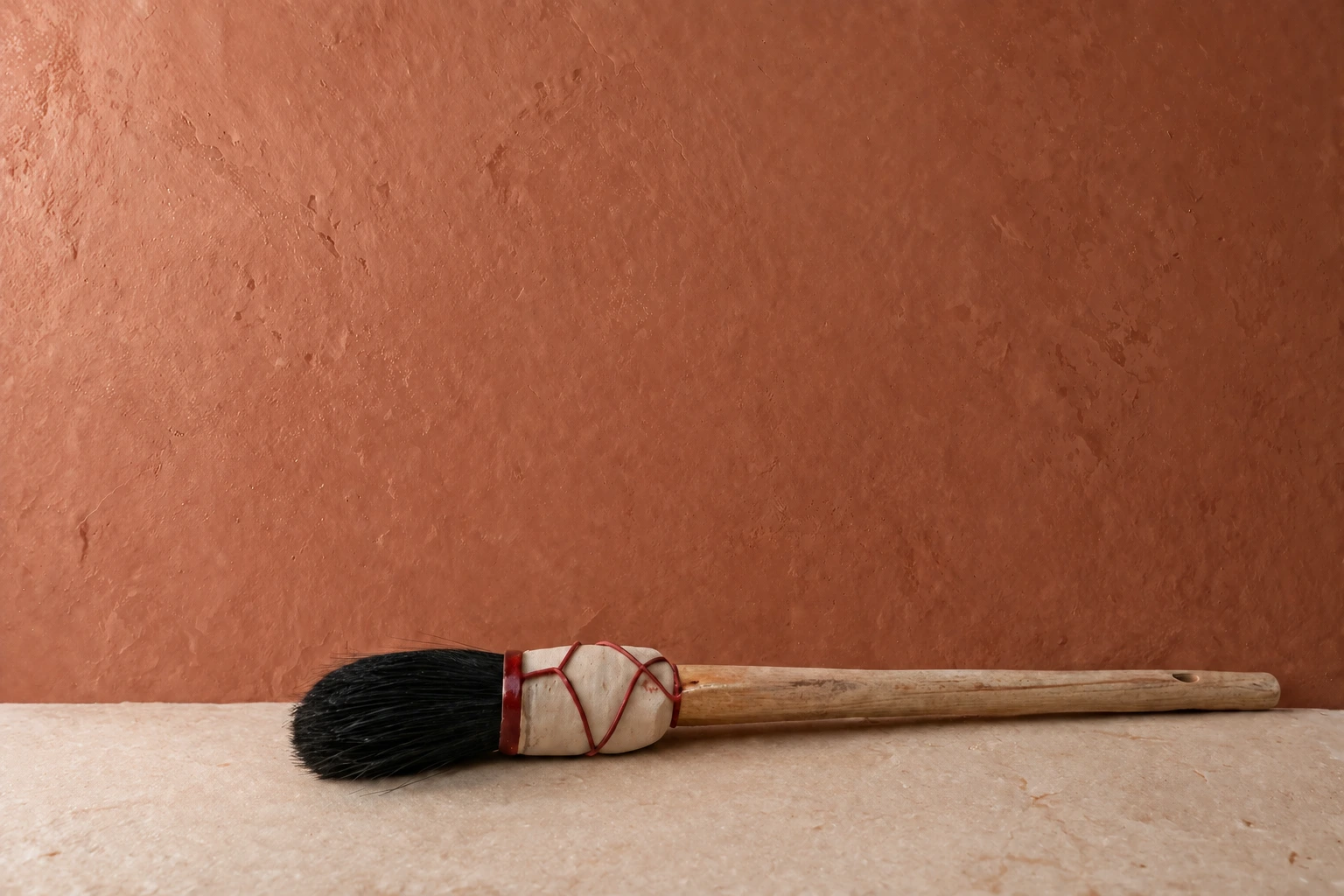 Specialist brush used to apply decorative mineral finishes with handcrafted precision.